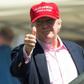 President Donald Trump salutes wellwishers at the US Women's Open Golf Championship at Trump National Golf Course in Bedminister, New Jersey