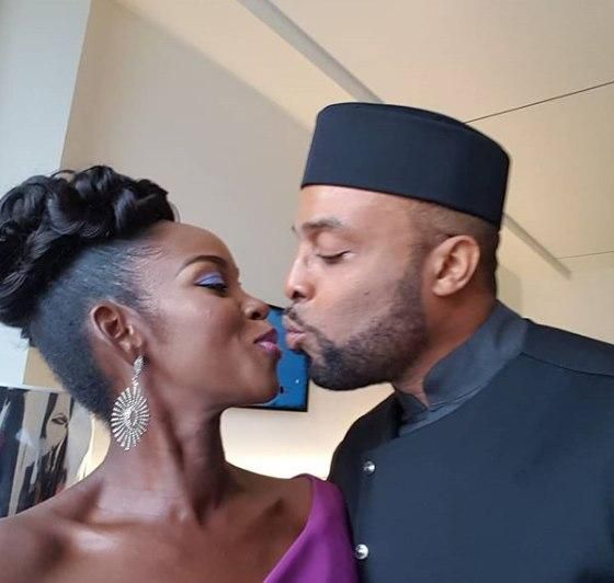 Kalu Ikeagwu and wife share a kiss just before walking on the red carpet of the 2018 AMVCAs.