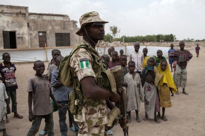 A Nigerian soldier patrols in the town of Banki in northeastern Nigeria on April 26, 2017. Banki has been totally destroyed during battles between the Nigerian army and Boko Haram insurgents. Over 32,000 people live in the town but free movement is lim...