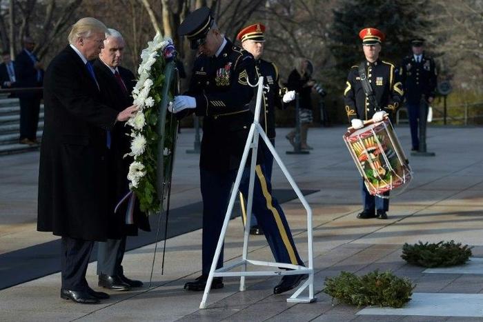 US President-elect Donald Trump and Vice President-elect Mike Pence take part in a wreath-laying ceremony at Arlington National Cemetery in Arlington, Virginia, on January 19, 2017