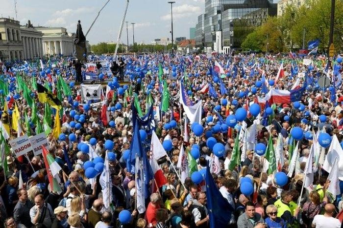 Tens of thousands of demonstrators attend the “Freedom March” in Warsaw, saying the rule of law is at stake