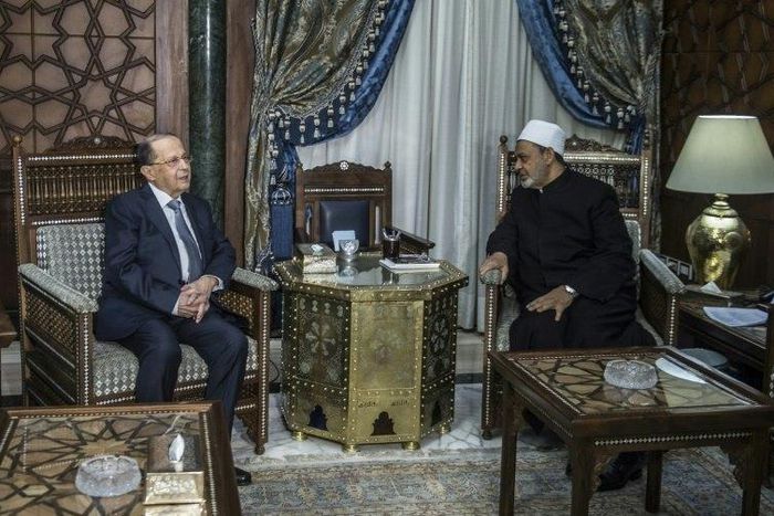 Egypt's Grand Imam of al-Azhar Sheikh Ahmed Mohamed al-Tayeb (right) receives Michel Aoun at his office in Cairo on February 13, 2017