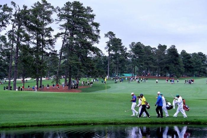 Jason Day of Australia, Yuta Ikeda of Japan and Sandy Lyle of Scotland, seen on the 16th hole during a practice round prior to the start of the 2017 Masters Tournament, at Augusta National Golf Club in Georgia, on April 3