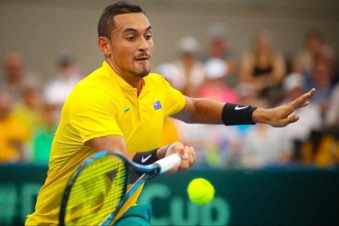 Nick Kyrgios of Australia hits a return against Sam Querrey of the US during their tennis match in the world group quarter-final Davis Cup clash between Australia and the USA in Brisbane on April 9, 2017
