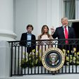 US President Donald Trump, alongside son Barron Trump (L) and US First Lady Melania Trump (2L), speaks during the Easter Egg Roll on the South Lawn of the White House in Washington, DC on April 17, 2017