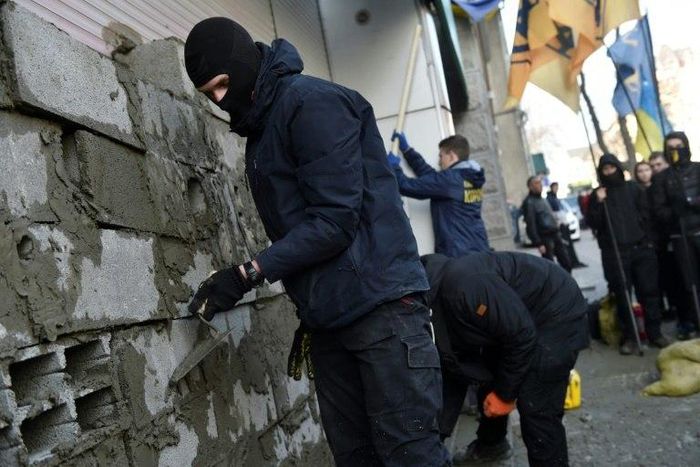 Activists blocking access to the offices of Sberbank helped push the Russian bank out of Ukraine