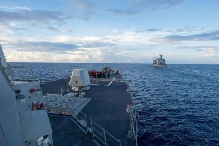 The USS Dewey (left) on duty in the South China Sea on May 19, 2017