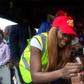 Tiwa Savage giving a child a polio vaccination