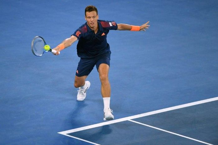 Czech Republic's Tomas Berdych hits a return against Switzerland's Roger Federer during their men's singles third round match on day five of the Australian Open tennis tournament in Melbourne on January 20, 2017