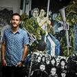 Colombian artist Juan Daniel Otoya, 28, poses beside his work in Cali, department of Valle del Cauca, Colombia, on January 12, 2017