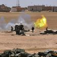 Syrian government forces fire artillery during a battle against the Islamic State group on May 16, 2017 in the town of Maskana, on the edge of Lake Assad in the eastern part of the Aleppo province