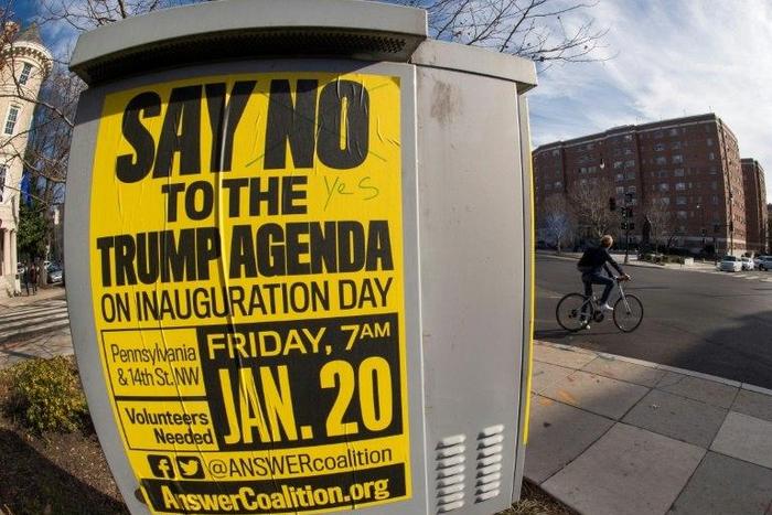 Street posters calling for protests are seen in the Dupont Circle area of Washington, DC, a week before the Inauguration of Donald Trump as US president