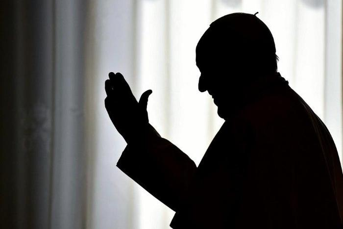 Pope Francis is silhouetted on March 24, 2017 at the Vatican
