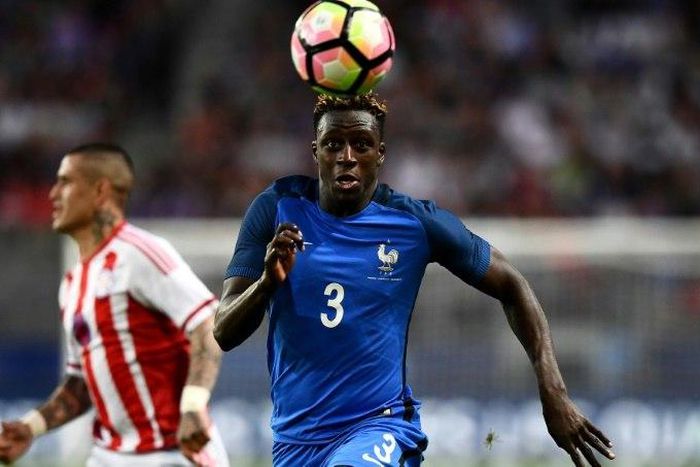France's defender Benjamin Mendy (right) eyes the ball during a friendly match against Paraguay on June 2, 2017 at the Roazhon Park stadium in Rennes