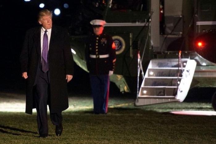 US President Donald Trump walks away from Marine One at the White House as he returns from his weekend trip to Mar-a-Lago