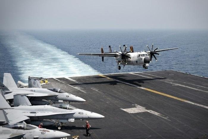 US Navy ships are sailing close to a contested island in the South China Sea in a show of strength to challenge China's territorial claims