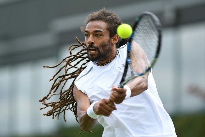 Germany's Dustin Brown returns against Portugal's Joao Sousa during their men's singles first round match on the first day of the 2017 Wimbledon Championships at The All England Lawn Tennis Club in Wimbledon, southwest London, on July 3, 2017