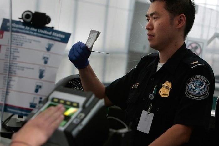 The New York Times reported that airport officials began detaining travelers following the president's executive order closing America's borders to refugees
