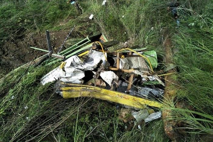 The wreckage of a bus lies in a gorge following an accident near the Indian town of Rampur on July 20, 2017