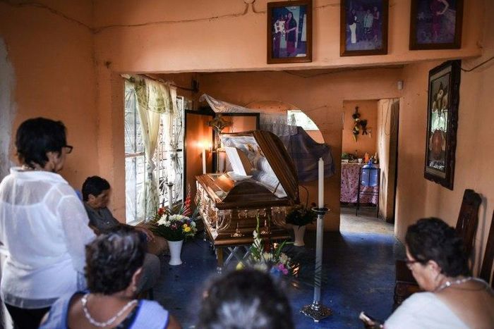 Relatives and friends mourn Mexican journalist Candido Rios during his wake in Hueyapan de Ocampo, Veracruz state, Mexico on August 23, 2017
