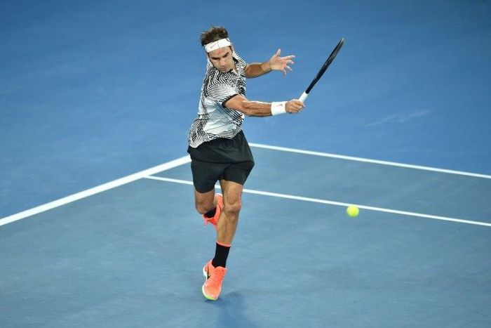 Roger Federer of Switzerland hits a return against Rafael Nadal of Spain during the men's singles final during the Australian Open tennis tournament January 29, 2017