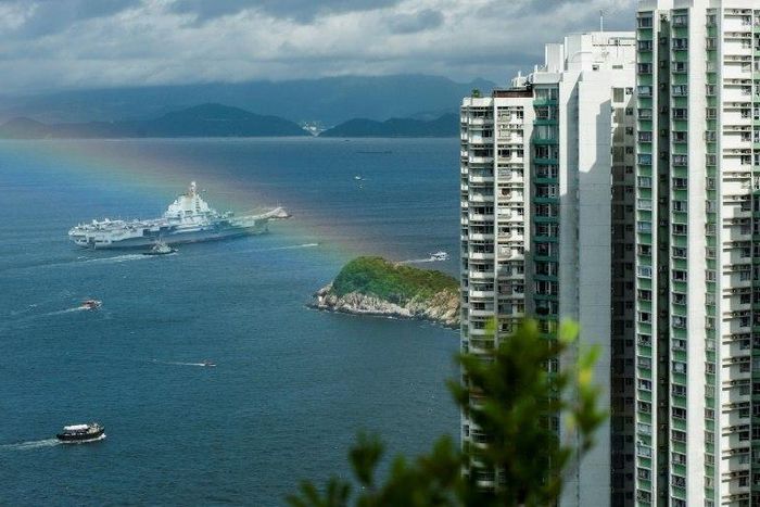 The 305 metre-long (1,000 feet) Liaoning, a secondhand Soviet ship built nearly 30 years ago and commissioned in 2012, arrived in Hong Kong early Friday, as a rainbow appeared overhead.
