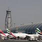 FILE PHOTO: Emirates Airlines aircrafts are seen at Dubai International Airport, United Arab Emirates May 10, 2016.