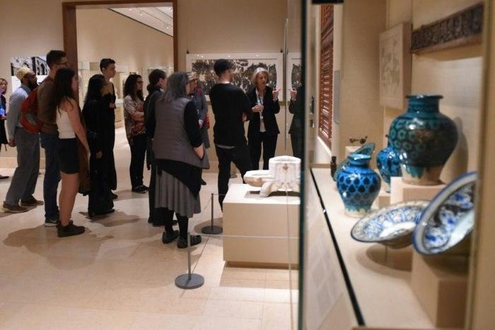 Curators at the Metropolitan Museum of Art talk to visitors about works created in the lands that are now Iraq, Syria, Iran and Yemen, four of the seven countries affected by the recent travel ban