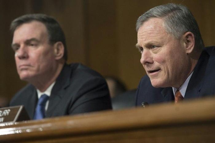 Senators Mark Warner (L) and Richard Burr -- chair of the Senate Select Committee on Intelligence -- promised a thorough investigation of Russian meddling in the presidential election at a hearing on Thursday