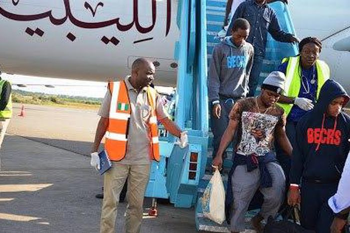 Nigerians alighting the plane from Libya