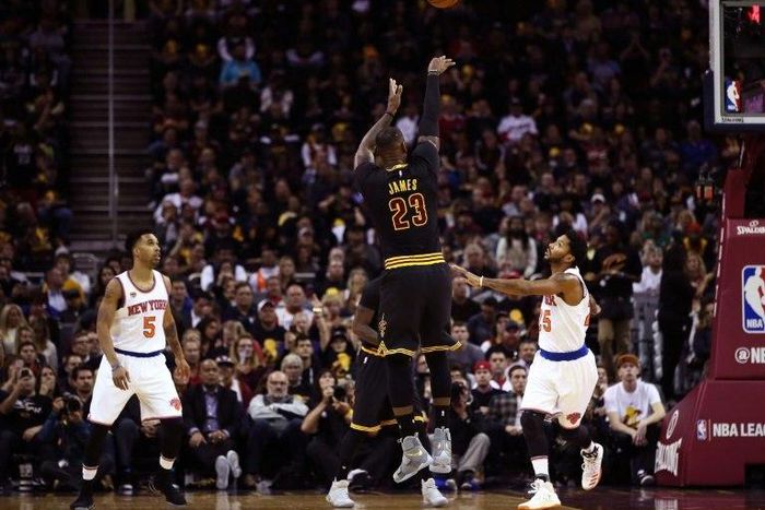 LeBron James #23 of the Cleveland Cavaliers shoots in the first quarter against Derrick Rose #25 of the New York Knicks on October 25, 2016 in Ohio