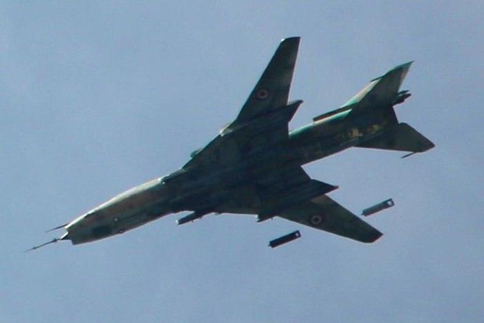A Syrian Sukhoi SU-17 drops bombs over Jobar district on the eastern outskirts of Damascus on March 20, 2017