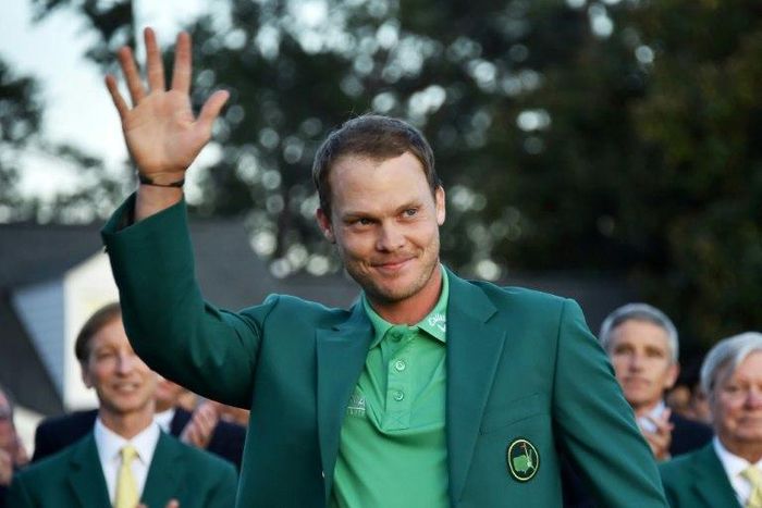 England's Danny Willett waves wearing the Green Jacket at the end of the 80th Masters Golf Tournament at the Augusta National Golf Club on April 10, 2016, in Augusta, Georgia