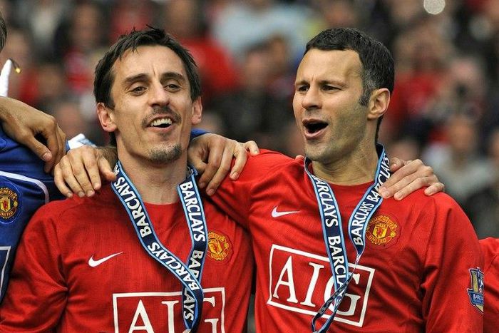 Gary Neville (L) and Ryan Giggs celebrate winning the Premiership with Manchester United in 2009