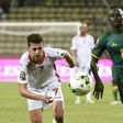 Tunisia's Youssef Msakni (L) fights for the ball with Senegal's Sadio Mane during their 2017 Africa Cup of Nations Group B match, in Franceville, on January 15, 2017