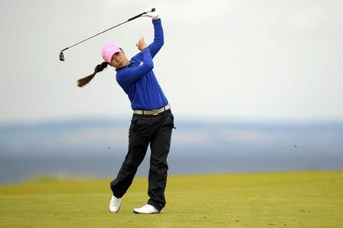 Korea's Kim In-Kyung watches her shot on the 4th hole during her final round of the 2017 Women's British Open Golf Championship on August 6, 2017