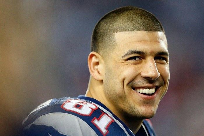 Former New England Patriots tight end Aaron Hernandez, pictured in December 2012, is currently serving a life sentence in prison without parole for murdering Odin Lloyd, a semi-pro football player in June 2013