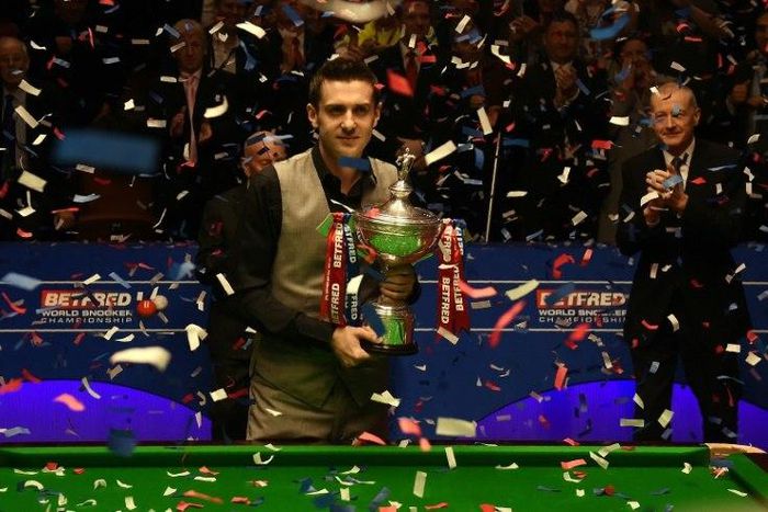 England's Mark Selby poses with the trophy after beating China's Ding Junhui in the final of the World Snooker Championship at the Crucible theatre in Sheffield, northern England, on May 2, 2016