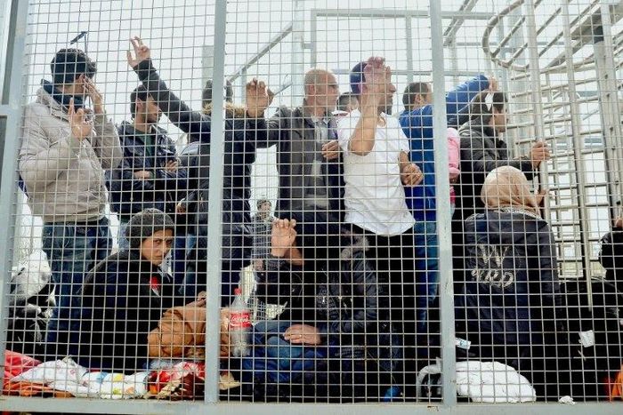 Migrants wait to enter the Hungarian transit zone near the border with Serbia in April 2016
