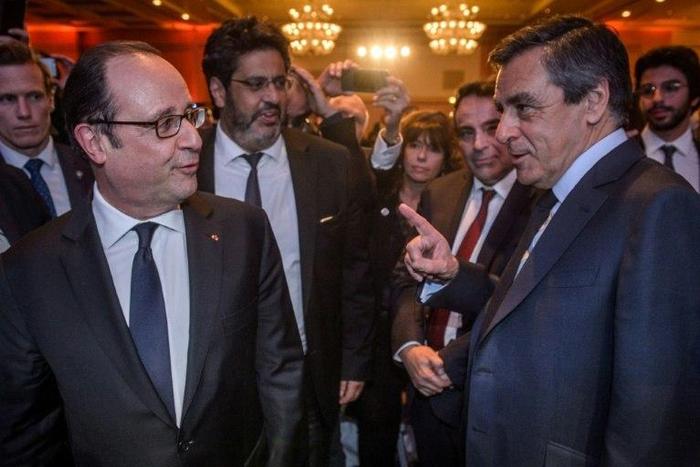 French centre-right presidential candidate Francois Fillon (R) accuses President Francois Hollande (L) of orchestrating media leaks that have dented his image
