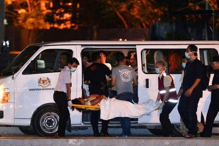 Twenty Chinese tourists have been rescued and sent to hospital after the boat they were on sank off Borneo