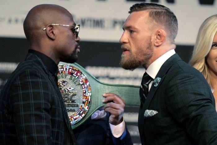 Boxer Floyd Mayweather Jr. (L) and MMA figher Connor Mcgregor face-off during a media press conference August 23, 2017 at the MGM Grand in Las Vegas, Nevada