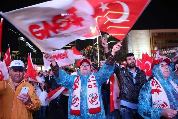 Supporters of Turkish President Recep Tayyip Erdogan celebrate as the 'Yes' camp claims victory in a referendum on changes to the constitution to give him greater powers