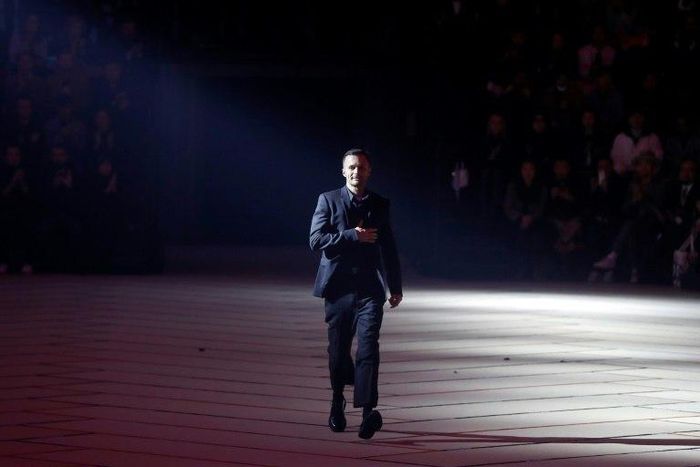 Artistic director for Dior Homme, Belgian fashion designer Kris Van Assche, acknowledges the public at the end of the men's Fashion Week for the Fall/Winter 2017/2018 collection in Paris on January 20, 2017