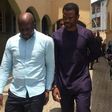Lekki Gardens MD, Richard Nyong (right) and contractor arrive an Ebute-Meta Magistrate Court in handcuffs on Friday, March 11.