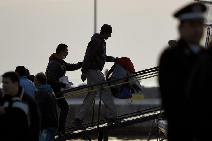 Migrants are deported to Turkey from the Greek port of Mytilene in April 2016