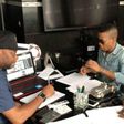 Tekno signing his Sony Deal.