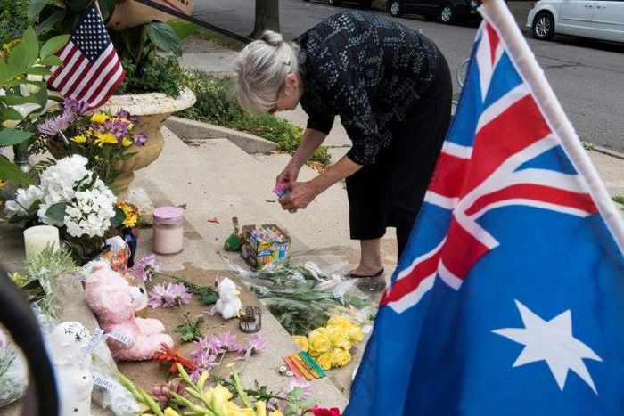 A woman places flowers at a makeshift memorial in Minneapolis, Minnesota to Justine Damond, an Australian woman shot to death by police Nancy Coune, administrator of the Lake Harriet Spiritual Community centre, places flowers and signs memorializing