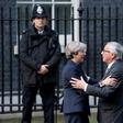 European Commission President Jean-Claude Juncker (R) is greeted by British Prime Minister Theresa May outside 10 Downing Street in London