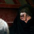 An Iraqi woman, who has fled fighting between government forces and the last jihadists in Mosul's Old City, awaits to be relocated on July 8, 2017